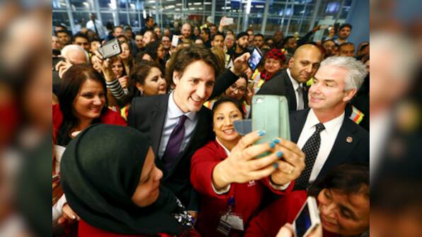 Plane carrying 163 Syrian refugees arrives in Canada, PM Trudeau calls for 'open hearts'