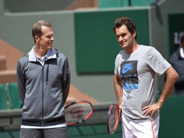 Roger Federer and his former coach Stefan Edberg at a training session. AFP