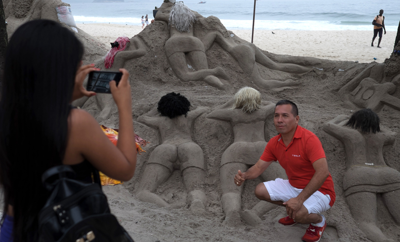 Feeling hot hot hot: Risqué sand sculptures of women on Copacabana beach irk local Brazilians Feeling hot hot hot: Risqué sand sculptures of women on Copacabana beach irk local Brazilians