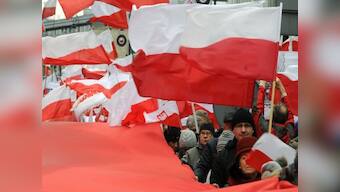 Priest and govt supporters 'exorcise' newspaper in Poland