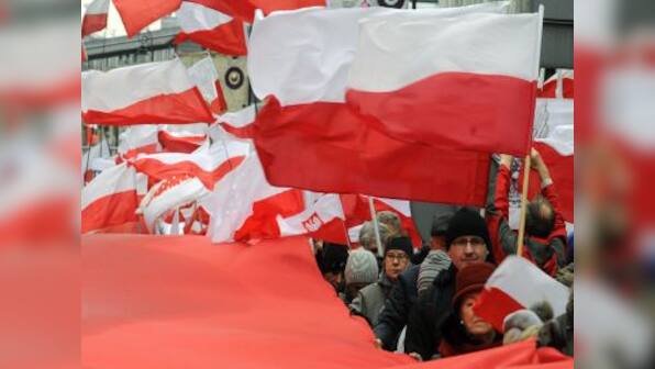 Priest and govt supporters 'exorcise' newspaper in Poland