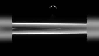 Saturn's silver sheen: Nasa unveils photo of the planet's crescent moon