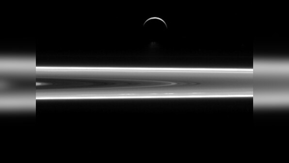 Saturn's silver sheen: Nasa unveils photo of the planet's crescent moon