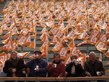 People wait for the start of a campaign rally of Ciudadanos party in Madrid. AP 
