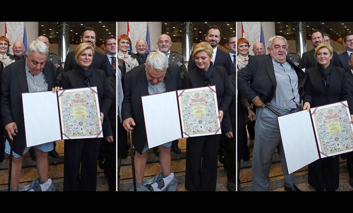 A novel photo-op: Croatia rights chief's trousers drop while posing for picture with president