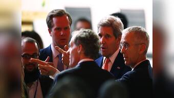 Hugs and tears of joy: Nearly 200 countries adopt historic Paris climate change pact