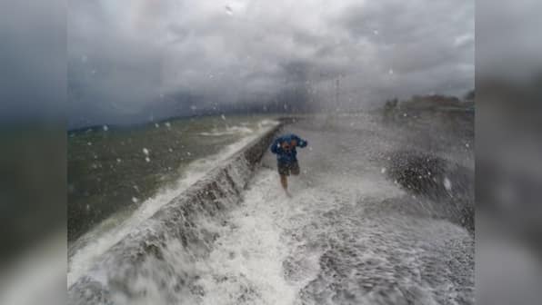 Millions without power, three dead as typhoon hits Philippines