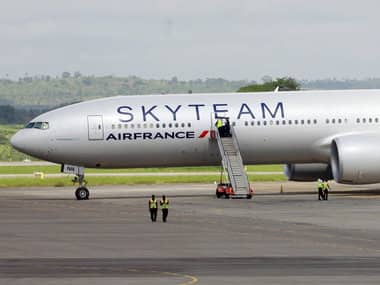Airport workers are seen near the Air France Boeing 777 aircraft that made an emergency landing in Kenya. Reuters