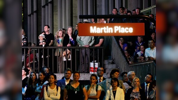 'Sydney stands together': Australians honour victims of cafe siege on first anniversary