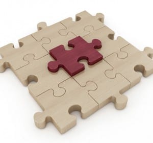 wooden jigsaw puzzle with one piece in mahogany - rendering