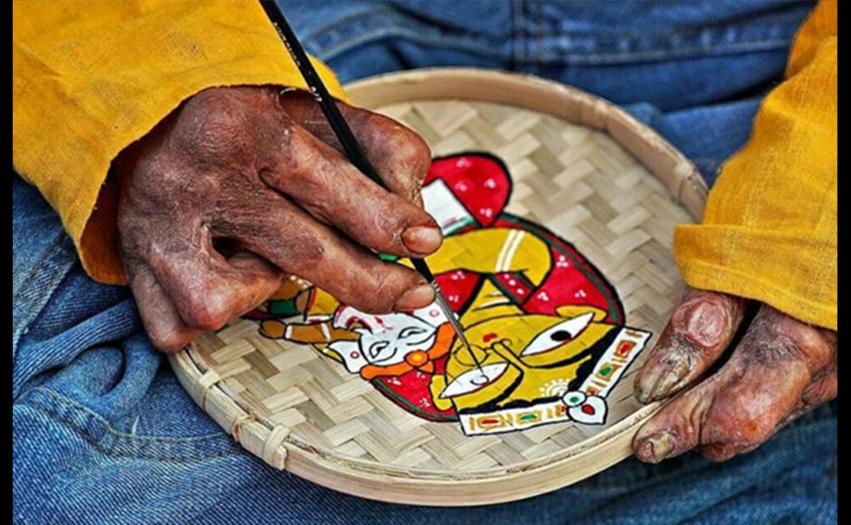 Sammya Brata Mullick, a 27-year-old consultant, captures the beauty of the weathered hands of a local artist as he paints an image of Goddess Durga with Lord Ganesha seated in her lap, during the local festival of Durga Puja. Sammya Brata Mullick, a 27-year-old consultant, captures the beauty of the weathered hands of a local artist as he paints an image of Goddess Durga with Lord Ganesha seated in her lap, during the local festival of Durga Puja.
