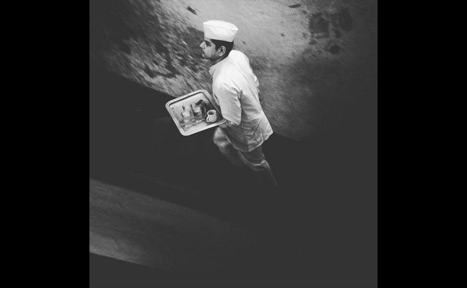A waiter dressed in a classic white uniform, rushes up the stairs of Kolkata's The College Street Coffee house in this photograph by 31-year-old Anindito Mukherjee, a photojournalist with Reuters. With its Victorian charm and classic menu, the coffee house continues to be a popular hangout, for artists, intellectuals and the youth. A waiter dressed in a classic white uniform, rushes up the stairs of Kolkata's The College Street Coffee house in this photograph by 31-year-old Anindito Mukherjee, a photojournalist with Reuters. With its Victorian charm and classic menu, the coffee house continues to be a popular hangout, for artists, intellectuals and the youth.