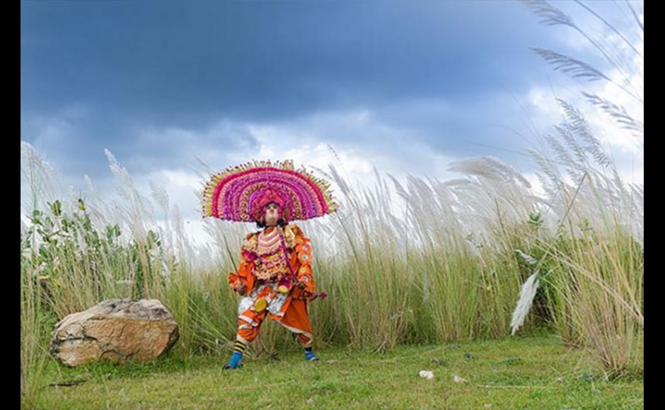 Seasonal flowers named Kash form a beautiful background as a masked Chhau dancer enacts the character of a warrior at Purulia, near Ayodhya Hill in West Bengal in this photograph by 36-year-old Arghya Chatterjee Seasonal flowers named Kash form a beautiful background as a masked Chhau dancer enacts the character of a warrior at Purulia, near Ayodhya Hill in West Bengal in this photograph by 36-year-old Arghya Chatterjee