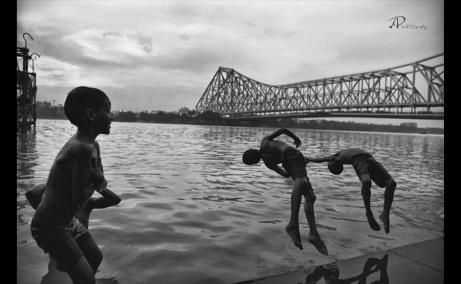 Graphic designer Arpita Pramanick, 24, beautifully captures the essence of summer in Kolkata in this photograph. Shot at Mullick Ghat, the photo shows local children playfully jumping into the Ganges against the backdrop of the Howrah bridge. Graphic designer Arpita Pramanick, 24, beautifully captures the essence of summer in Kolkata in this photograph. Shot at Mullick Ghat, the photo shows local children playfully jumping into the Ganges against the backdrop of the Howrah bridge.