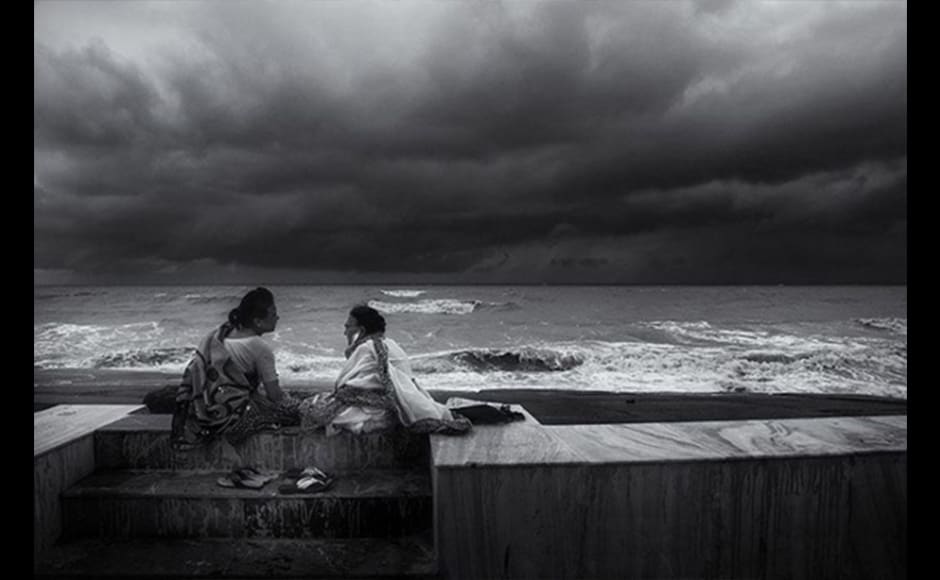 Photographer Madhabendu Hensh, 29, shot this image during the monsoon season in Digha, a beach in West Bengal, in 2014. Digha is one of the most tourist-friendly places in West Bengal but these two ladies seated beside the sea ignored him, just as they ignored the drizzle. Hensh took the opportunity to capture this very interesting moment. Photographer Madhabendu Hensh, 29, shot this image during the monsoon season in Digha, a beach in West Bengal, in 2014. Digha is one of the most tourist-friendly places in West Bengal but these two ladies seated beside the sea ignored him, just as they ignored the drizzle. Hensh took the opportunity to capture this very interesting moment.