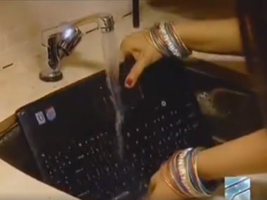 Watch: Woman from Indian TV show tells you how not to handle a laptop Watch: Woman from Indian TV show tells you how not to handle a laptop