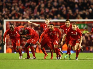 Liverpool celebrate after edging Stoke City 6-5 on penalties. Getty