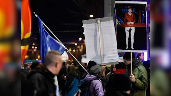 'Deport them': Protesters blame refugees for Cologne violence, rally against Angela Merkel