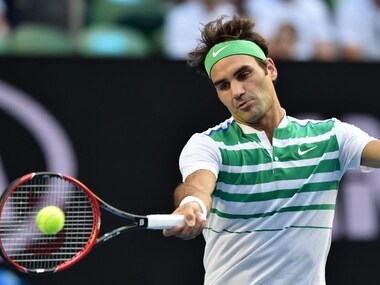 Roger Federer in action in the first round of Australian Open. AFP