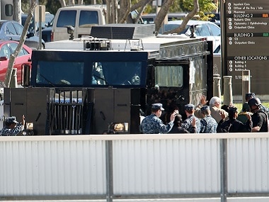 People are directed to come out of buildings on the campus of Naval Medical Center San Diego. AP