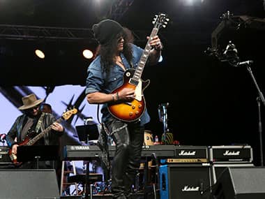 Slash onstage with Myles Kennedy and the Conspirators. Getty Images