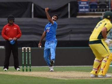 Umpire John Ward wearing a helmet in the fourth ODI between India and Australia at Canberra. AFP