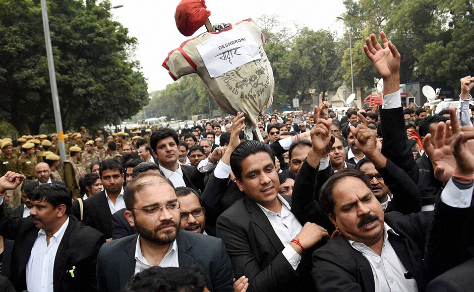 New Delhi: Lawyers carry an effigy as they march from Patiala House Courts to India Gate against alleged anti-national activities at JNU, in New Delhi on Friday. PTI Photo by Atul Yadav