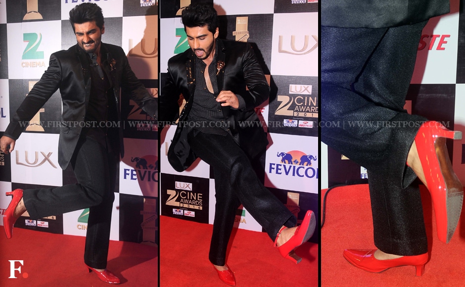 Arjun Kapoor is definitely pulling off the androgynous look with his red heels! He wore these Manish Malhotra kitten heels to promote his upcoming move <em>Ki and Ka </em>and incidently, the film's song 'High Heels' sung by rapper Yo Yo Honey Singh releases on Sunday. Sachin Gokhale/Firstpost Arjun Kapoor is definitely pulling off the androgynous look with his red heels! He wore these Manish Malhotra kitten heels to promote his upcoming move <em>Ki and Ka </em>and incidently, the film's song 'High Heels' sung by rapper Yo Yo Honey Singh releases on Sunday. Sachin Gokhale/Firstpost
