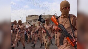 Islamic State group attack kills 32 by Syria refugee camp on Iraq border