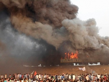 Agitators belonging to the Kapu caste set fire to Ratnachal Express when it halted at Tuni railway station in East Godavari district on Sunday afternoon. PTI