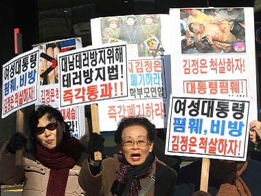 North Korean defectors shout slogans during a rally to denounce North Korea's criticism of South Korean President Park Geun-hye in Seoul. AP