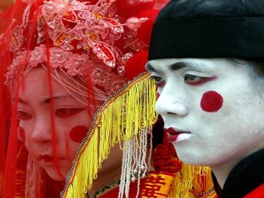 Artists dressed as ghost bride and groom. Reuters