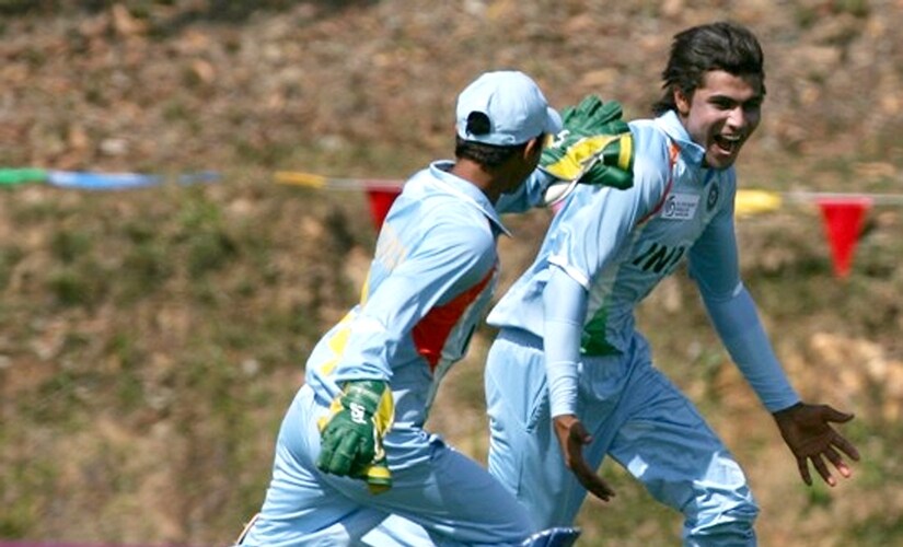 Guess who the jubilant young man on the right is? AFP