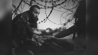 'Haunting' image of baby at barbed wire fence wins World Press Photo Award