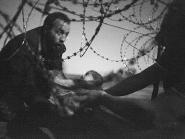 'Haunting' image of baby at barbed wire fence wins World Press Photo Award