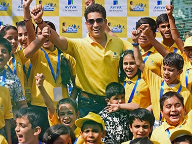 Sachin Tendulkar with kids during a promotional event in Mumbai on Friday. PTI