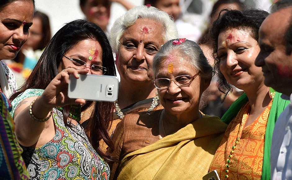 Former Delhi chief minister Sheila Dikshit with party workers during the Holi celebrations at All India Congress Committee headquarters (AICC) in New Delhi on Thursday. PTI Photo