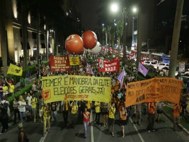 Demonstrators protest against the impeachment of Brazil's President Dilma Rousseff and in support of former President Luiz Inacio Lula da Silva in Sao Paulo, Brazil, Thursday, 24 March 2016. AP