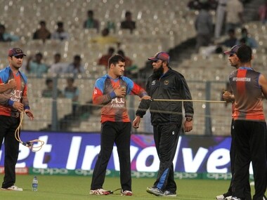 Afghanistan players warm up as Afghanistan coach Inzamam-ul-Haq looks on. Solaris Images