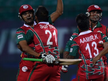 Ajay Lalcheta and Oman team-mates celebrate win over Ireland. AFP
