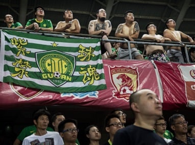 Fans of the Beijing Guoan FC in a match against Chongcing Lifan FC in 2015. Getty Images