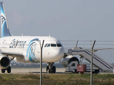 EgyptAir Hijack: Four crew members and three passengers onboard with Hijacker, most passengers freed EgyptAir Hijack: Four crew members and three passengers onboard with Hijacker, most passengers freed