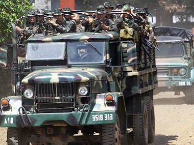 Philippine troops clash with Abu Sayyaf's militants, kill seven and wound rebel chief