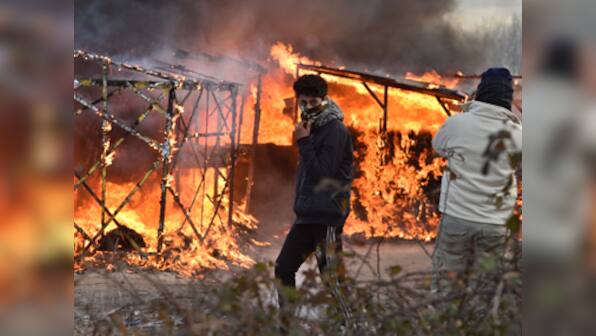 French police clash with immigrants in Calais as 'jungle' encampment demolished