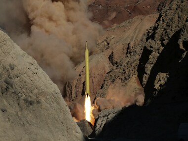 Iran’s powerful Revolutionary Guard test-fired two ballistic missiles Wednesday with the phrase "Israel must be wiped out" written on them, a show of deterrence power by the Islamic Republic as US Vice President Joe Biden visited Israel, Fars news agency reported. (AP Photo/Fars News Agency)