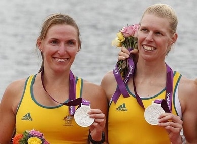 Australia's silver medalists Kate Hornsey (L) and Sarah Tait stand during the victory ceremony after the women's pair finals at Eton Dorney during the London 2012 Olympic Games. Reuters