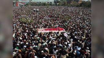 'Qadri, your blood will bring the revolution': Islamist supporters during the funeral of Salman Taseer's killer