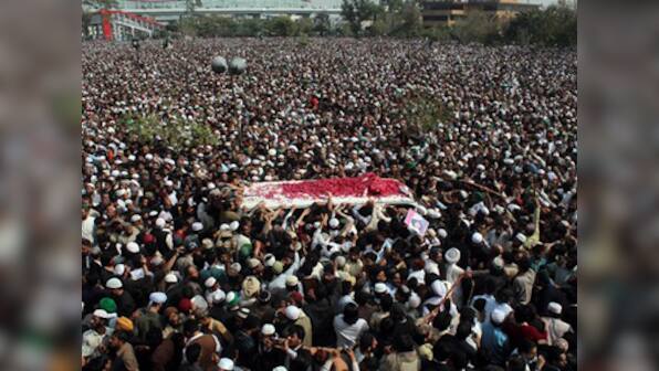 'Qadri, your blood will bring the revolution': Islamist supporters during the funeral of Salman Taseer's killer