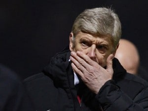 Arsenal's coach Arsene Wenger reacts during their English League Cup soccer match against Bradford City in Bradford, northern England December 11, 2012. REUTERS/Nigel Roddis (BRITAIN - Tags: SPORT SOCCER CAPITAL ONE CUP)