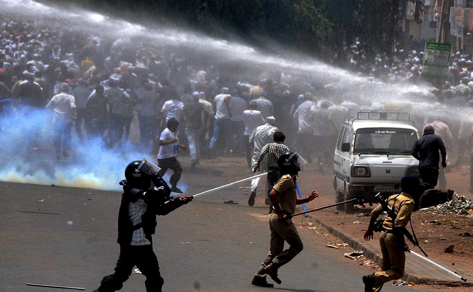 The police uses a water canon to control members of Patidar community during their The police uses a water canon to control members of Patidar community during their